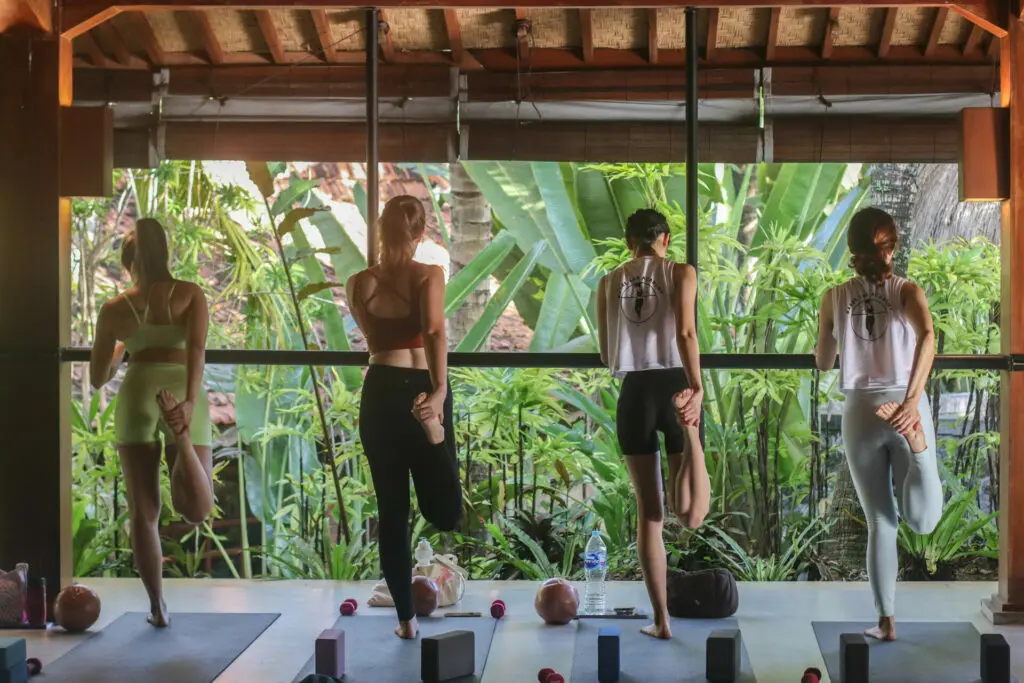 Women stretching at the barre in Bali